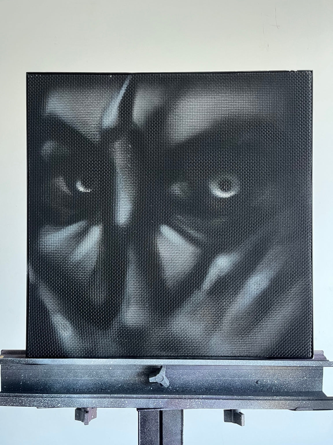 CAGED by HEEM — clean full view of the artwork displayed on easel