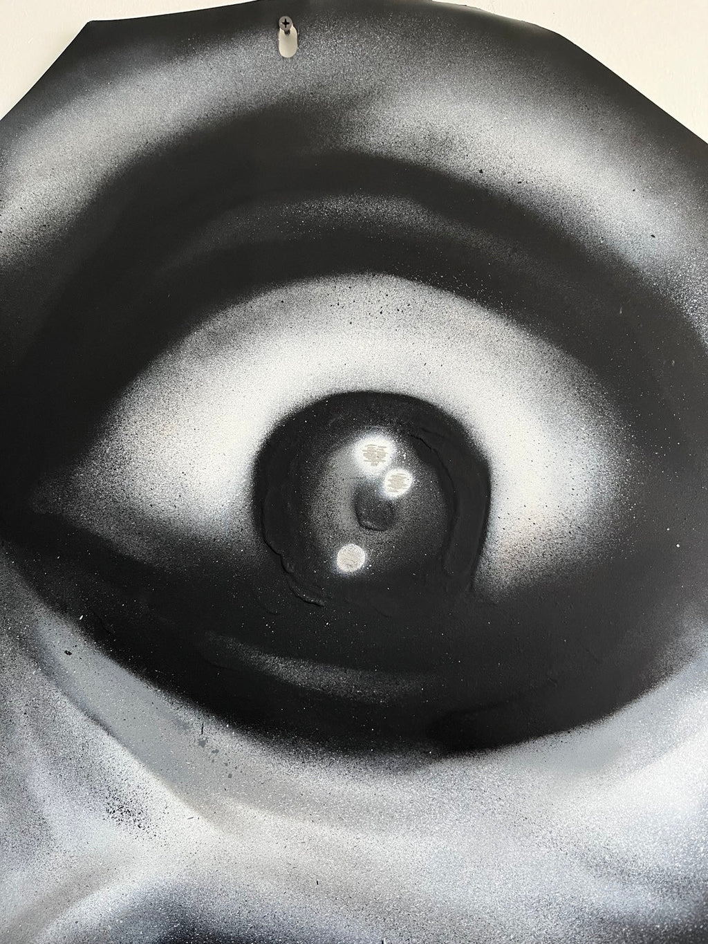 STOP by HEEM — close detail showing spray-paint texture and eye